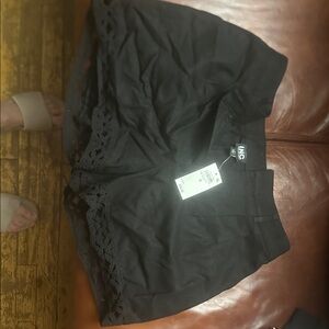 International concept black crochet shorts
Size 8
Brand new with tags